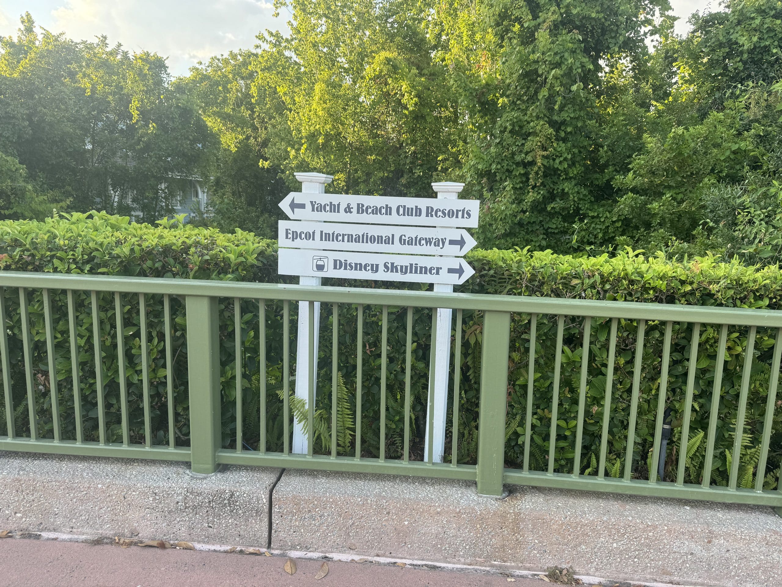 walking pathway signage on the Boardwalk, pointing to Epcot, Skyliner station, and Yacht & Beach Clubs