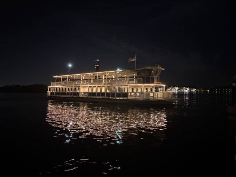 Disney World ferry boat at night on the Seven Seas Lagoon