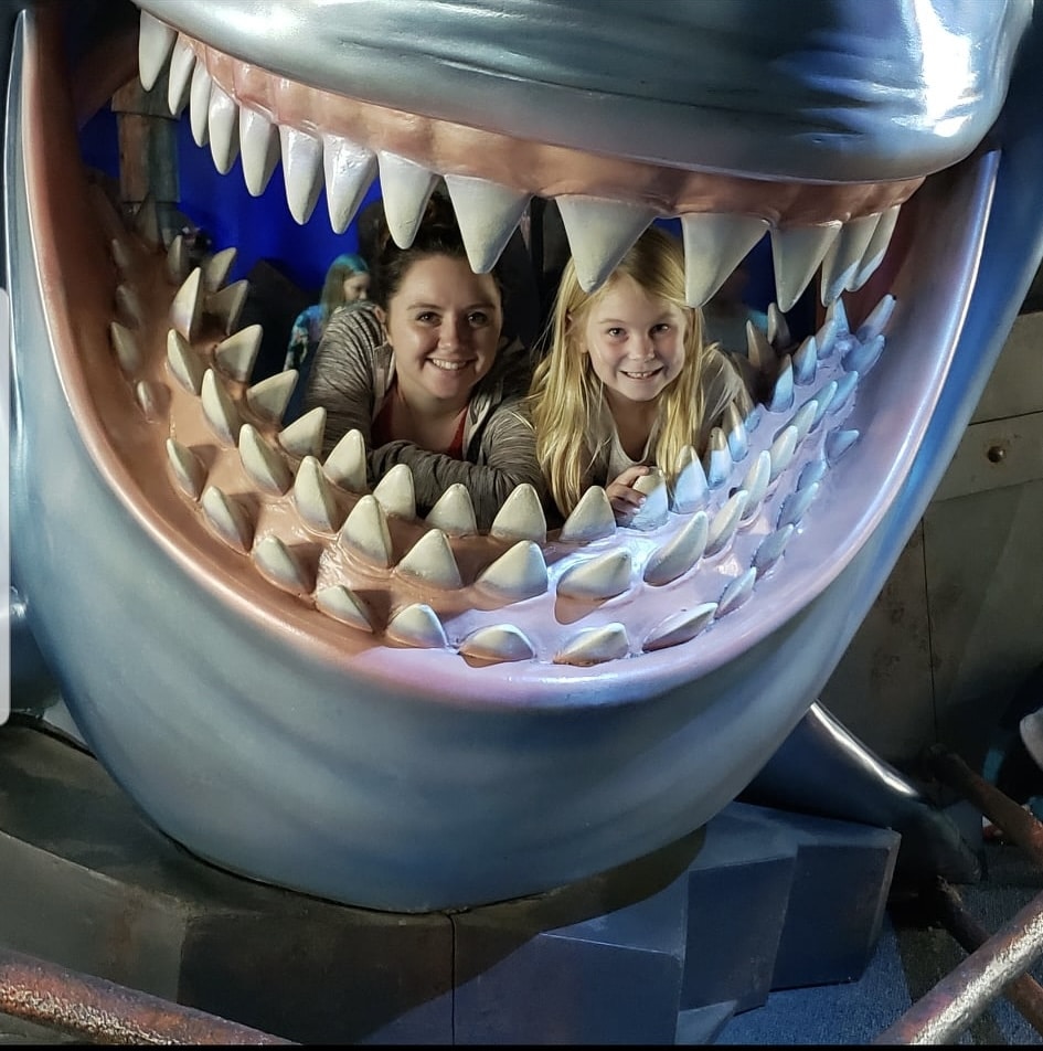 my niece & I in the mouth of a shark at Turtle Talk with Crush