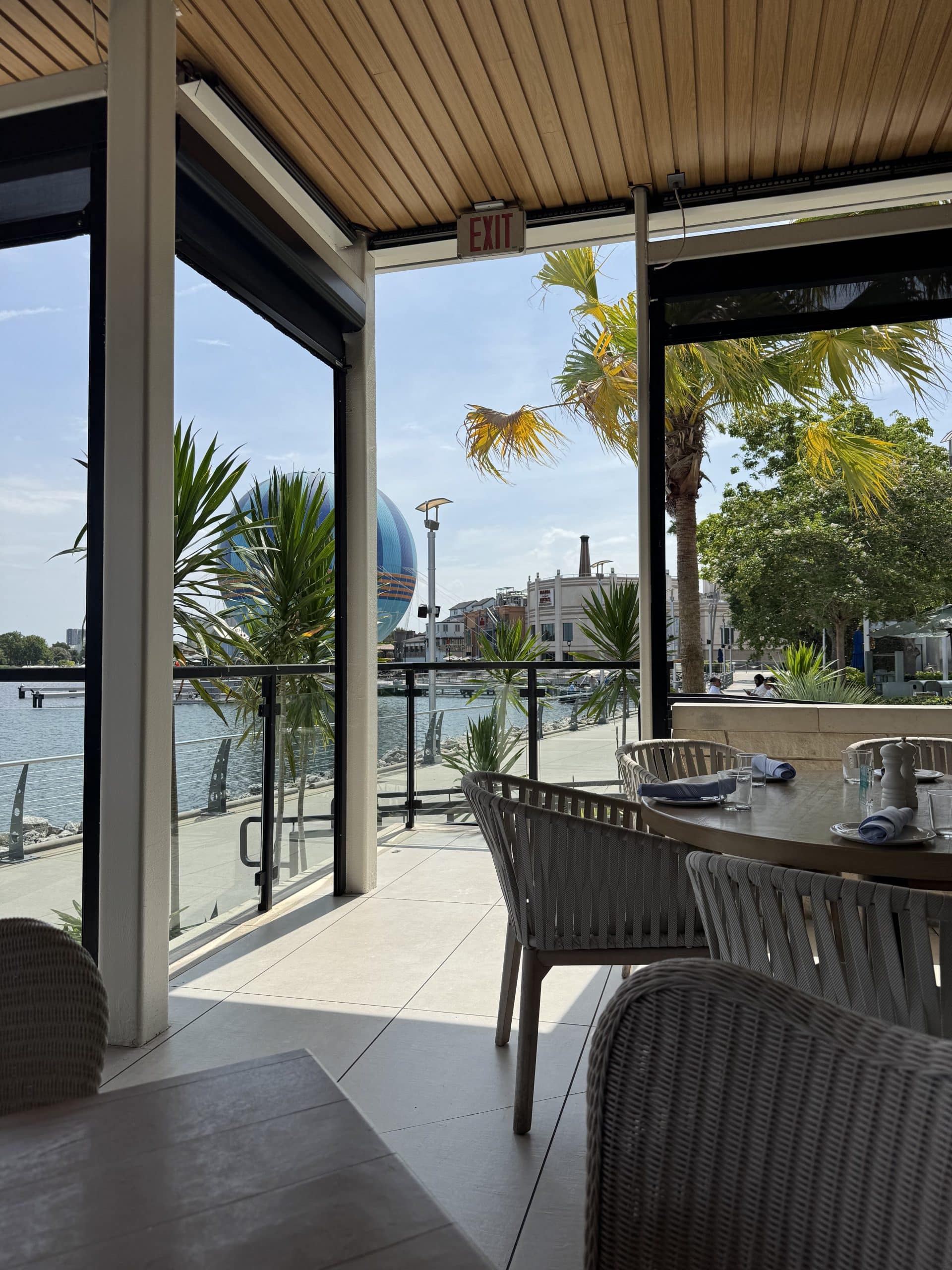 back patio at Summer House on the Lake in Disney Springs, with a view of the hot air balloon in the background